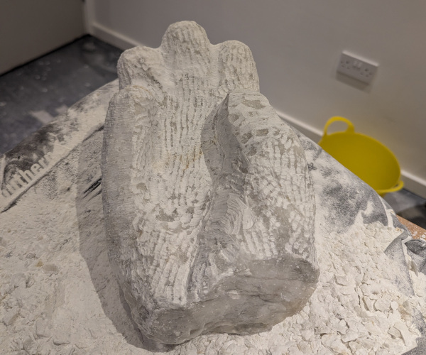 a sculpture depicting a hand